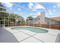 Large screened-in pool area with a fenced-in yard, perfect for outdoor entertaining and relaxation at 4401 Arranmore Cir, Valrico, FL 33596