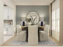 Tastefully designed dining room showcasing a round mirror, stylish lamps, and elegant decor at 4511 S Manhattan Ave # 13, Tampa, FL 33611