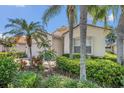 Charming home featuring a well-maintained lawn, lush landscaping, and a two-car garage at 6315 43Rd E Ct, Sarasota, FL 34243