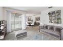 Comfortable living room with large window, modern furniture and decorative shelving at 7035 Drury St, Tampa, FL 33635