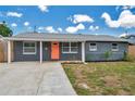 Delightful single-Gathering home featuring fresh landscaping, a concrete driveway and a cheerful front entrance at 8497 Portulaca Ave, Seminole, FL 33777
