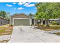 Lovely single-Gathering home featuring a neutral-toned exterior, attached two-car garage, and well-kept landscaping at 13643 Tramore Dr, Odessa, FL 33556