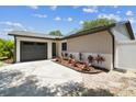 This property has a lovely landscaped front yard and a convenient attached garage at 13835 Pathfinder Dr, Tampa, FL 33625