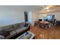 Spacious living room with hardwood floors, neutral paint, and dining table at 1538 S Lake Ave, Clearwater, FL 33756