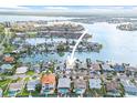 Beautiful aerial view of waterfront home with private boat dock on a canal at 5 Marina Ter, Treasure Island, FL 33706
