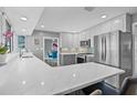 Modern kitchen featuring stainless steel appliances, a peninsula, and white cabinets at 5080 43Rd S St, St Petersburg, FL 33711