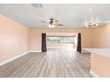 Light and airy living area showcasing beautiful flooring and neutral walls at 5108 Commonwealth Rd, Palmetto, FL 34221