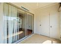 This outdoor patio features tiled floors and is accessed through sliding glass doors at 7701 Starkey Rd # 504, Seminole, FL 33777