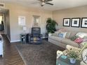 Comfortable living room featuring a plush sofa, recliner, and decorative accents at 8455 112Th St # 212, Seminole, FL 33772