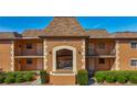 Inviting condo exterior featuring multiple units and a well-maintained facade at 12900 Vonn Rd # D202, Largo, FL 33774