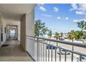 Enjoy partial views of the beach and street from this cozy condo balcony at 200 1St Ave # 309, St Pete Beach, FL 33706