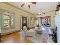Bright living room with hardwood floors, stylish furniture, and seamless transition to the next room at 202 39Th S Ave, St Petersburg, FL 33705