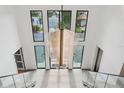 Staircase view with modern chandelier and staircase at 2902 S Beach Dr, Tampa, FL 33629