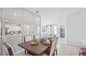 Open concept dining room with view of the living room and kitchen, great for entertaining at 31450 Paper Birch St, Wesley Chapel, FL 33545