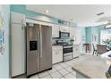 Bright kitchen featuring stainless steel appliances and white cabinetry at 3520 51St W Ave, Bradenton, FL 34210