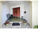 Inviting front porch with double doors and decorative tile flooring at 3900 38Th S St, St Petersburg, FL 33711