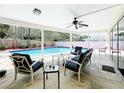 Covered patio featuring comfortable seating and a view of the sparkling pool at 3900 38Th S St, St Petersburg, FL 33711