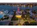 Beautiful waterfront home with lush landscaping and a private dock on a picturesque waterway at 474 20Th Ave, Indian Rocks Beach, FL 33785