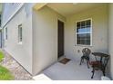 Inviting front porch with seating area, offering a cozy spot to relax outside the front door at 5270 Neil Dr, St Petersburg, FL 33714