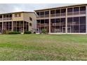 Spacious backyard with lush green grass, ideal for outdoor activities and enjoying nature at 9484 Tara Cay Ct # 8, Seminole, FL 33776