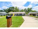 This lovely single-Gathering home has a mailbox, new driveway, and well-maintained lawn at 1005 Monroe St, Plant City, FL 33565
