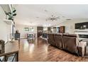Spacious living room and kitchen featuring modern flooring, fan, and natural light at 1005 Monroe St, Plant City, FL 33565