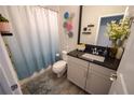 Stylish bathroom with a modern vanity, neutral grey and white decor, and shower with curtain at 13103 Monach Isles Dr, Riverview, FL 33579