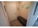 Cozy hallway with a padded bench and decor stars adds character and functionality at 13103 Monach Isles Dr, Riverview, FL 33579