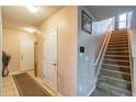 Spacious foyer leads to stairs, front door, and access to the rest of the home at 14560 Haddon Mist Dr, Wimauma, FL 33598