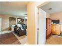 Open-concept floorplan showing living room with couch at 14560 Haddon Mist Dr, Wimauma, FL 33598