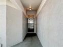 Narrow entrance way to the front door at 1556 Lynda Ln, Dunedin, FL 34698