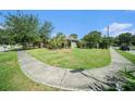 Well-maintained front yard, landscaping, and sidewalk at 1813 Nova Dr, Valrico, FL 33596