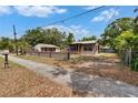 Charming home with well-maintained front yard and adjacent sidewalk at 1920 E Chelsea St, Tampa, FL 33610