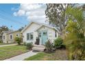 Cozy home featuring lush greenery, well-kept lawn, and inviting entryway at 2015 3Rd S St, St Petersburg, FL 33705