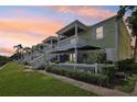 Townhome showcasing private patios, string lights, and outdoor lounging spaces for entertaining guests at 219 Pompano Se Dr # C, St Petersburg, FL 33705