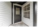 Elegant front entrance features a decorative glass door and a sidelight window at 2313 Palm Ave, Seffner, FL 33584