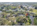 From above, discover this home's tranquil waterfront setting, surrounded by lush trees and neighborhood charm at 2416 S 46Th St, Tampa, FL 33619