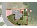 Aerial view of property highlighting its layout, landscaping and waterfront access with a private dock at 4315 Flexer Dr, Hernando Beach, FL 34607