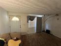 Bright living room with a couch, a window with gray curtains, and modern lighting fixtures at 4419 Atwood Dr, Tampa, FL 33610