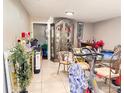 Bright dining room featuring tile floors and a decorative display cabinet at 4812 Bonita Vista Dr, Tampa, FL 33634