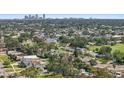Scenic aerial neighborhood view with mature trees, nearby river, and a glimpse of the city at 5340 Denver Ne St, St Petersburg, FL 33703