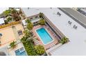 Aerial view of community pool and loungers; great for relaxing and enjoying the sun at 600 71St Ave # 18, St Pete Beach, FL 33706