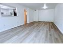 Bright living room featuring wood-look floors and neutral walls at 6206 Dewdrop Way # 0, Temple Terrace, FL 33617