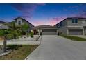 Charming single-Gathering home with a well-maintained lawn and neutral exterior paint, and a two car garage at 872 Olive Conch St, Ruskin, FL 33570