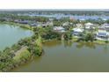 Waterfront home with lush landscaping, serene water views, and multiple docks available on the water at 8927 Key West Island Way, Riverview, FL 33578
