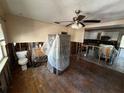 Open living room with hardwood floors, ready for renovation and customization at 9025 1St Ne St, St Petersburg, FL 33702