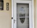 Unit 310 features a decorative front door with a glass window and a stylish black door number plate at 1 Boca Ciega Point Blvd # 310, St Petersburg, FL 33708
