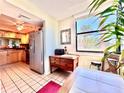 Bright breakfast nook featuring tile floors and stainless steel appliances at 1332 Pasadena S Ave # 208, South Pasadena, FL 33707