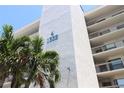 Close up view of waterfront condo building with palms at 1332 Pasadena S Ave # 208, South Pasadena, FL 33707