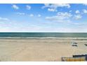 Expansive white sand beach with calm waves perfect for a relaxing vacation at 19010 Gulf Blvd # 203, Indian Shores, FL 33785